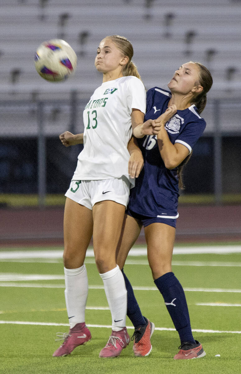 Green Valley sophomore Payton Colbrook (13) and Centennial midfielder Julianne Donnelly (16) ju ...