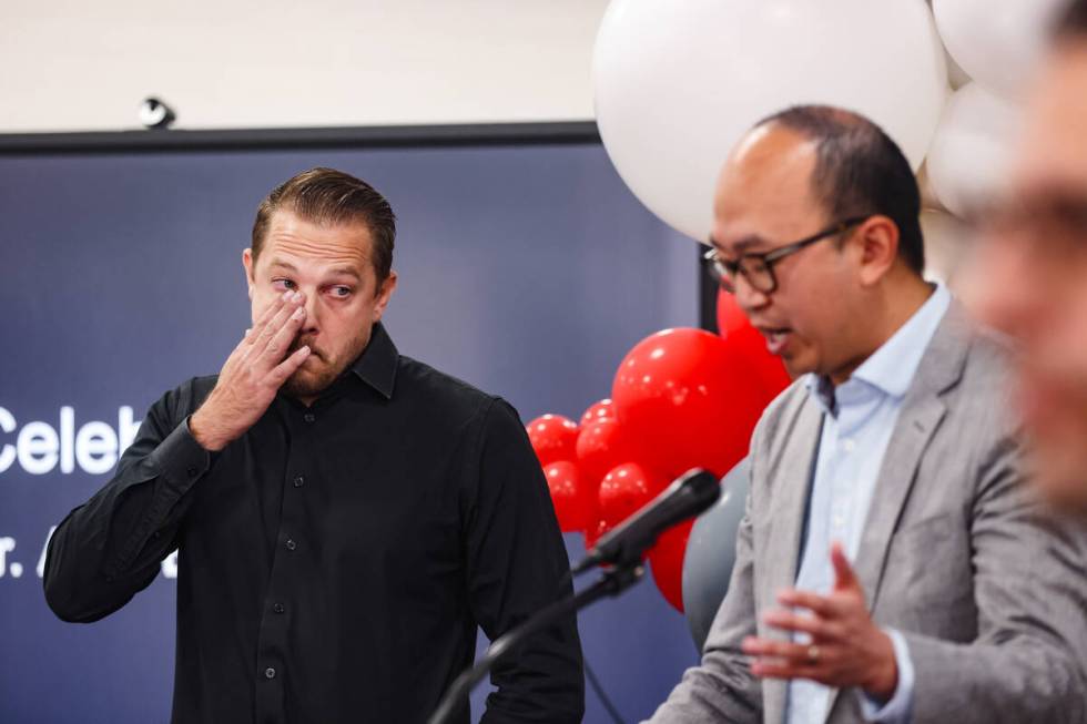 Alex Bechtler, a manufacturing teacher, reacts emotionally as Tae Kang, program manager with Ha ...