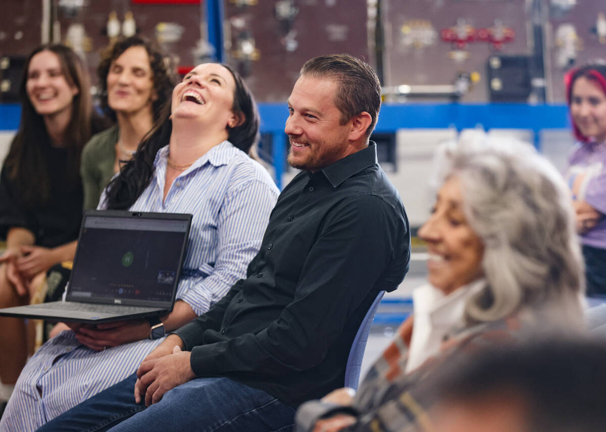 Alex Bechtler, a manufacturing teacher, reacts to a speech by a student at an event honoring hi ...