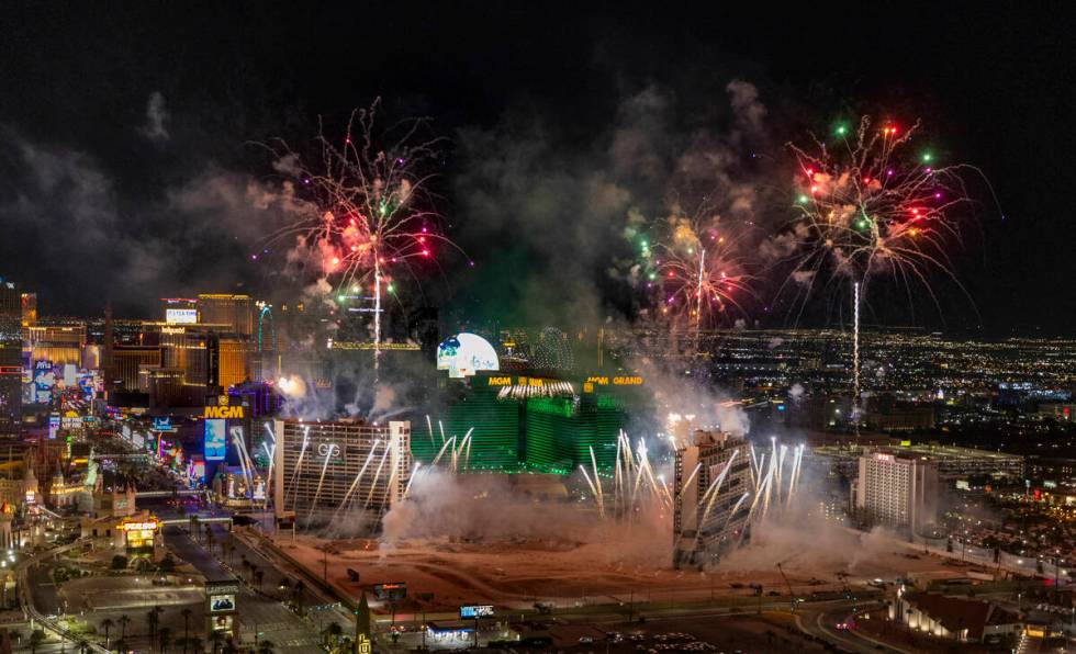 A fireworks and drone show precedes the Tropicana being imploded early in the morning while vie ...