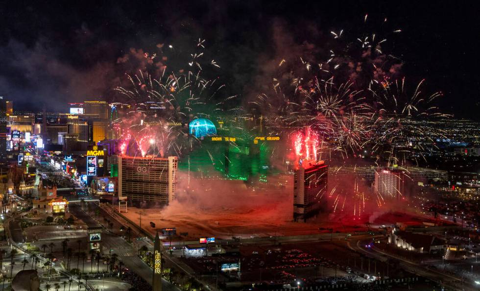 A fireworks and drone show precedes the Tropicana being imploded early in the morning while vie ...