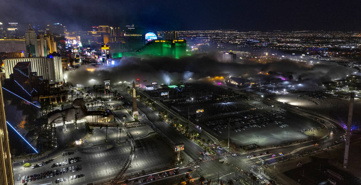 Dust from the Tropicana spreads after it is imploded early in the morning while viewed from the ...