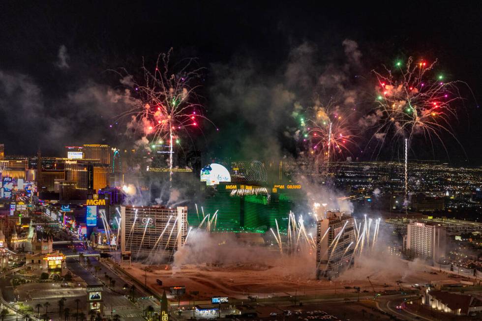 A fireworks and drone show precedes the Tropicana being imploded early in the morning while vie ...