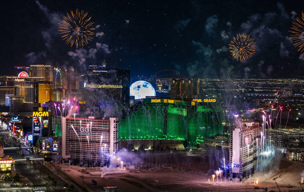 A fireworks and drone show precedes the Tropicana being imploded early in the morning while vie ...