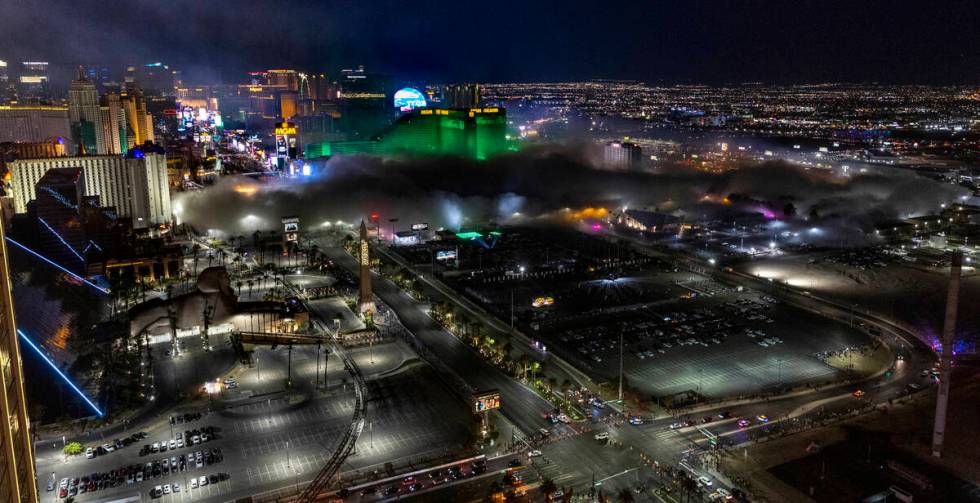 Dust from the Tropicana spreads after it is imploded early in the morning while viewed from the ...