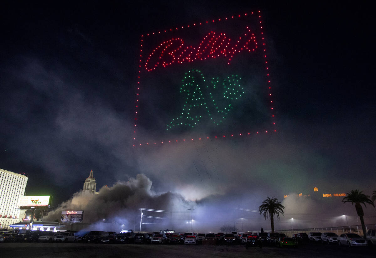 Drones fly above the smoke a debris from the Tropicana implosion, Wednesday, Oct. 9, 2024, in L ...