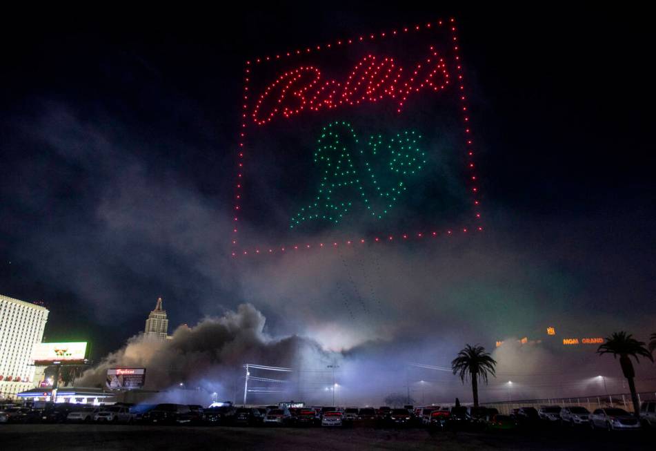 Drones fly above the smoke a debris from the Tropicana implosion, Wednesday, Oct. 9, 2024, in L ...