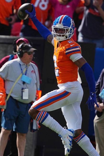 Denver Broncos cornerback Pat Surtain II (2) intercepts a pass for a 100 yard touchdown against ...