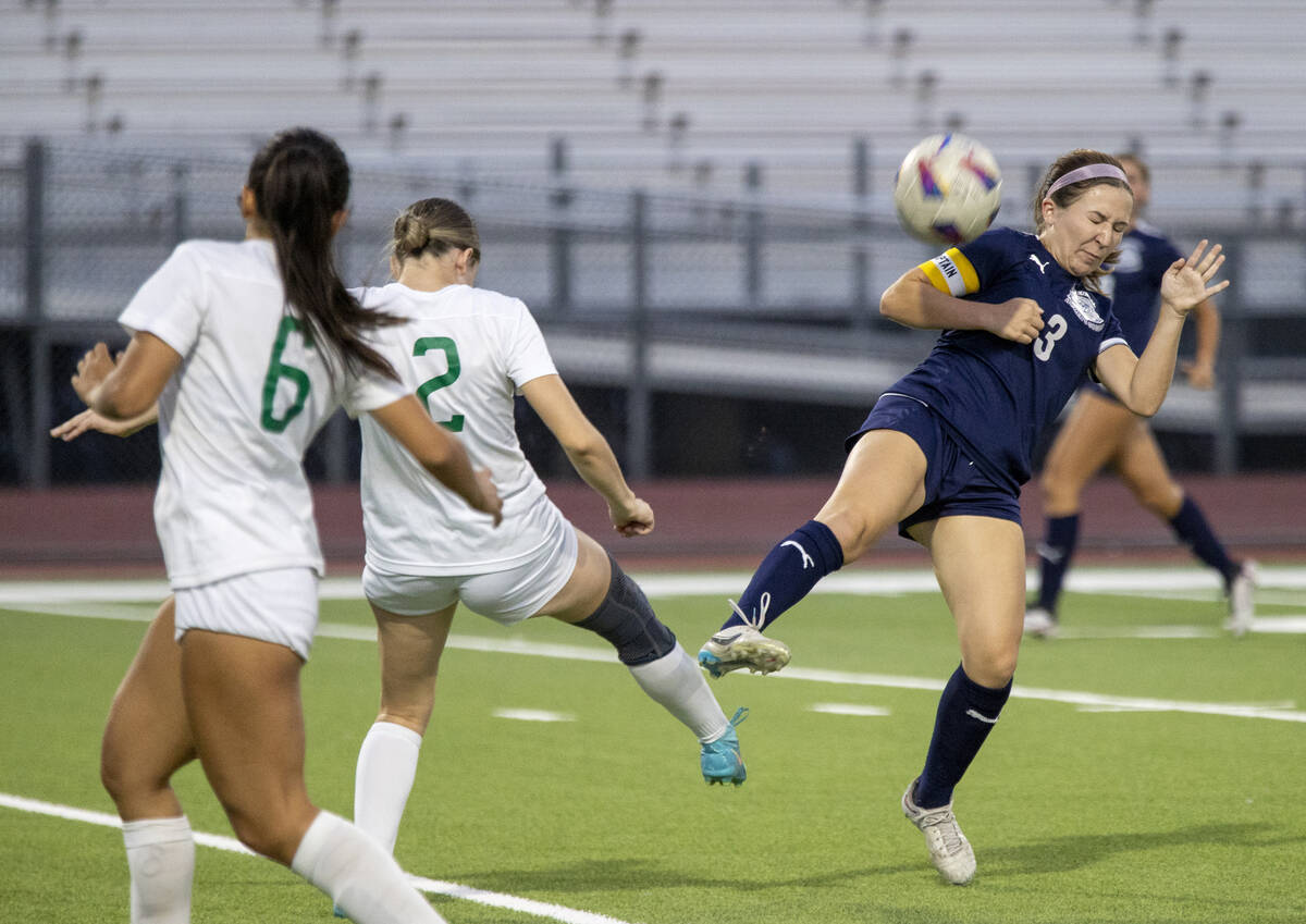 Centennial forward Natalie Sligar (3) blocks the ball during the high school soccer game agains ...