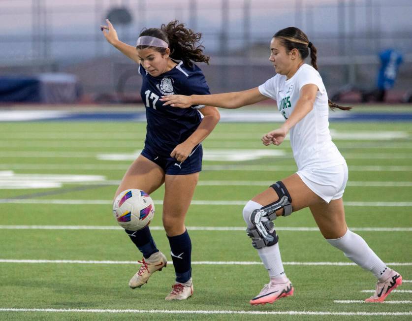 Centennial defender Cameryn Sligar (17) and Green Valley junior Darien Cox (5) compete for the ...