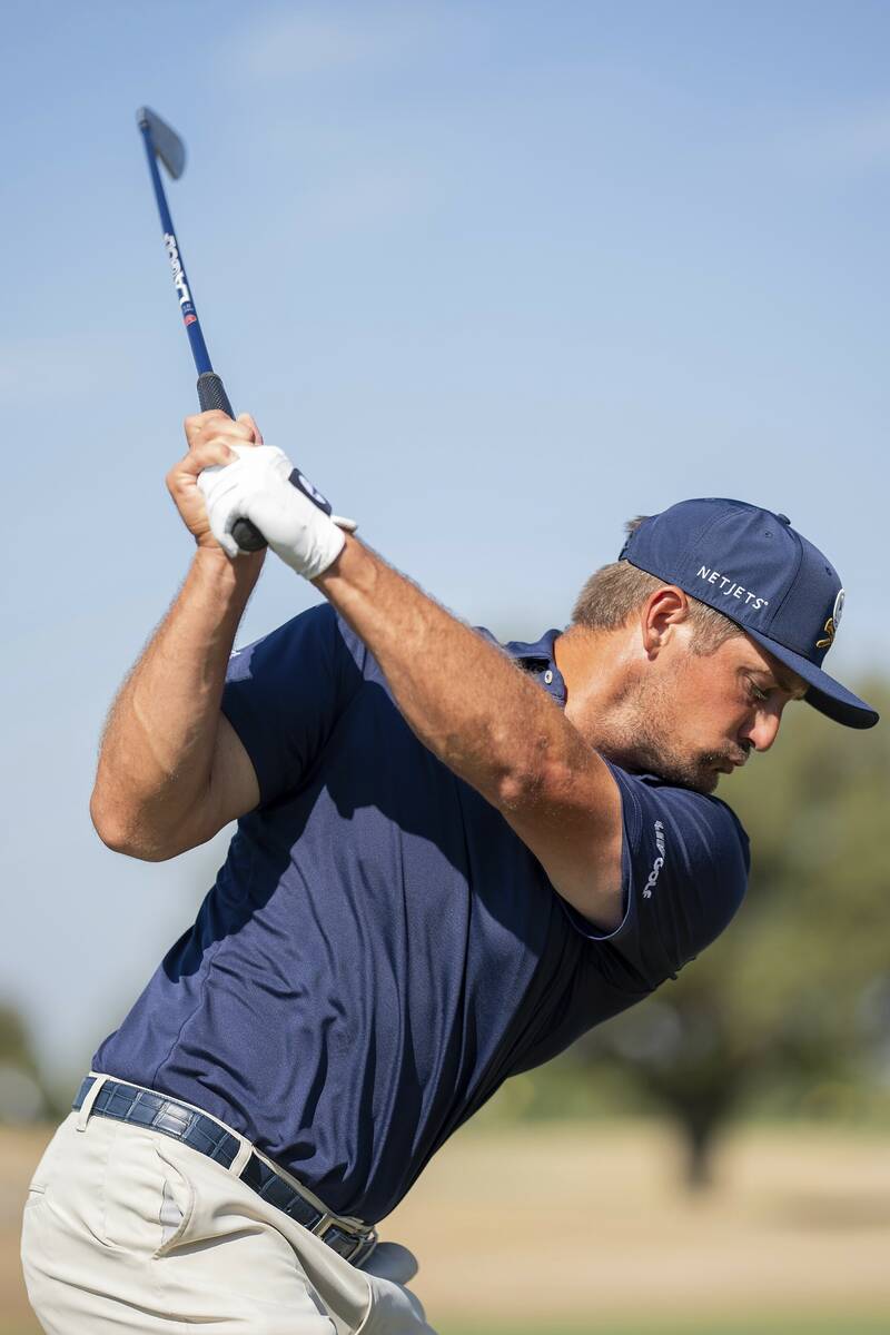 Captain Bryson DeChambeau of Crushers GC hits his shot on the driving range during the final ro ...