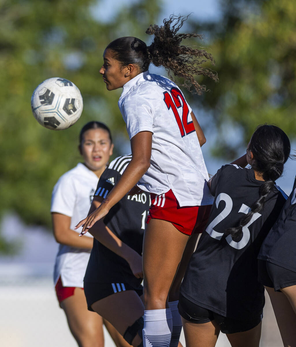 Liberty forward Ayva Jordan (7) heads the ball over Palo Verde forward Angelie Mendoza (23) dur ...