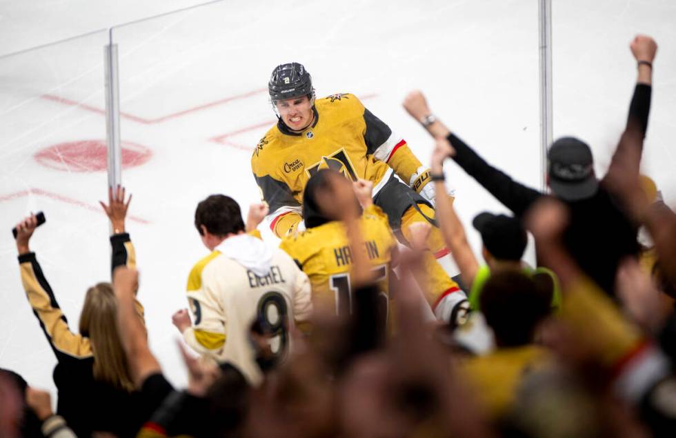 Vegas Golden Knights defenseman Zach Whitecloud (2) celebrates after scoring a goal during the ...