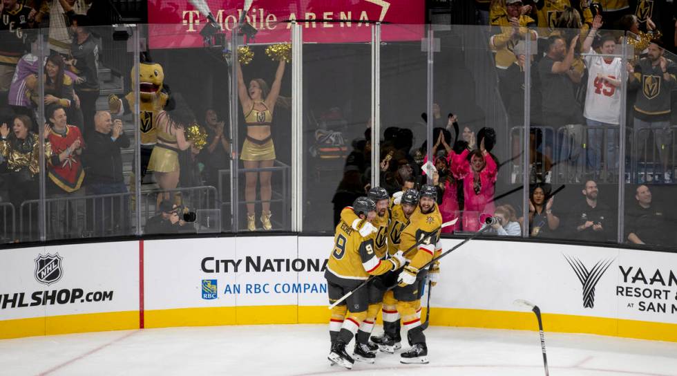 Vegas Golden Knights players celebrate a goal scored by right wing Mark Stone (61) during the f ...