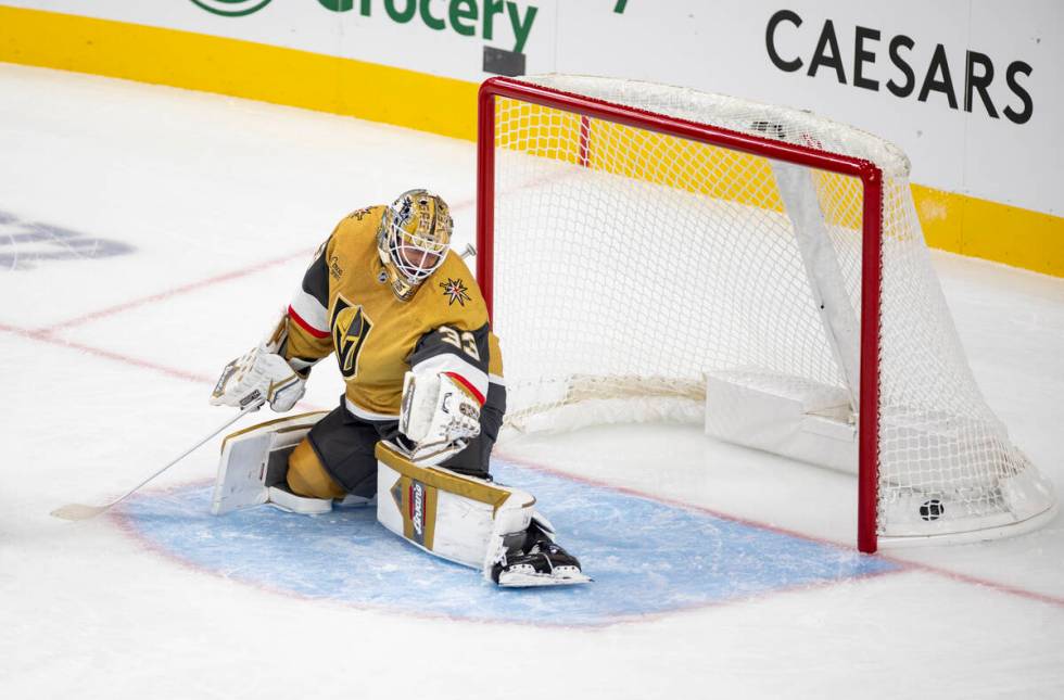 Vegas Golden Knights goaltender Adin Hill (33) allows a goal during the first period of the NHL ...