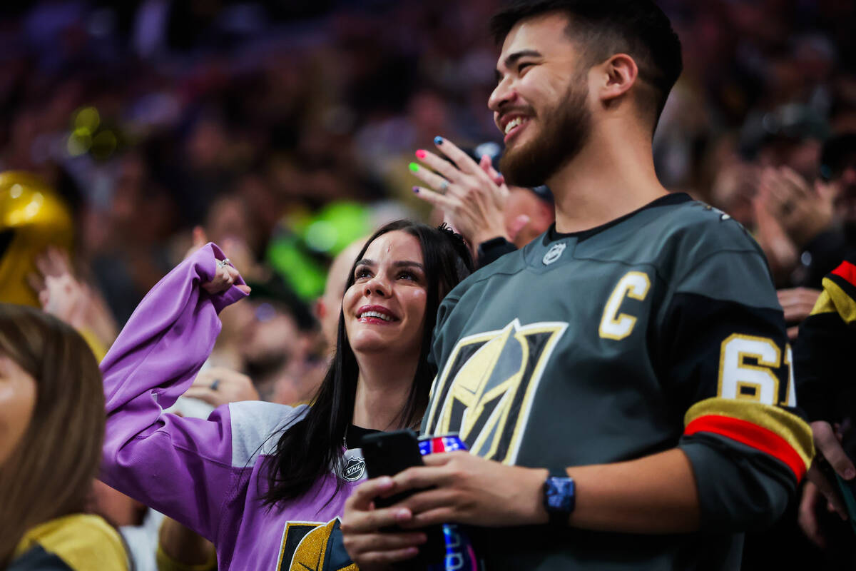 Golden Knights fans celebrate a goal during the Golden Knights’ NHL hockey season home o ...