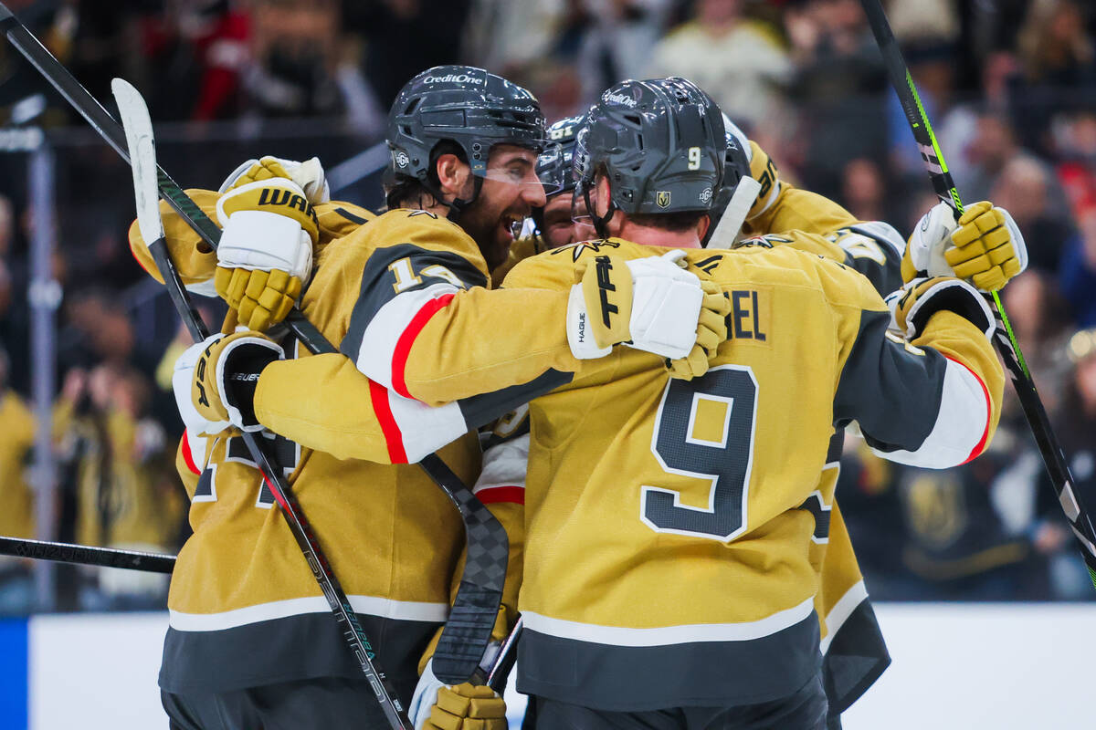 Golden Knights teammates celebrate a goal during the Golden Knights’ NHL hockey season h ...