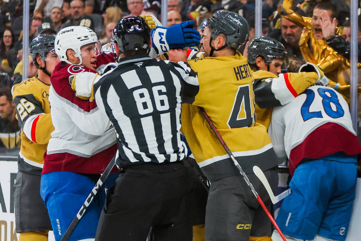 Colorado Avalanche and Golden Knights players fight during the Golden Knights’ NHL hocke ...