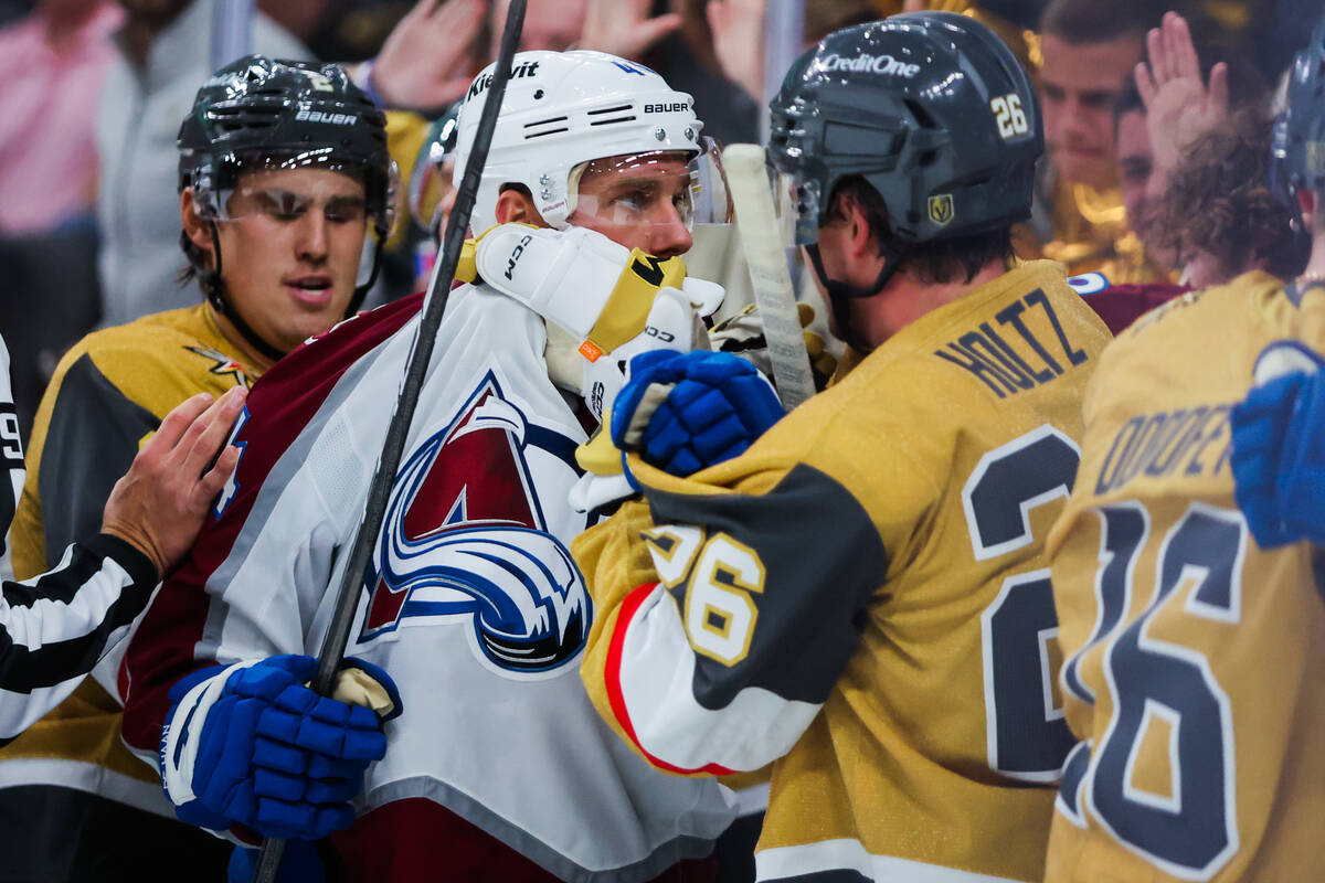 Colorado Avalanche defenseman Calvin de Haan (44) fights with Golden Knights right wing Alexand ...