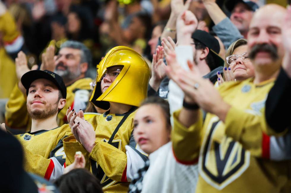 A Golden Knights fan cheers during the Golden Knights’ NHL hockey season home opener aga ...