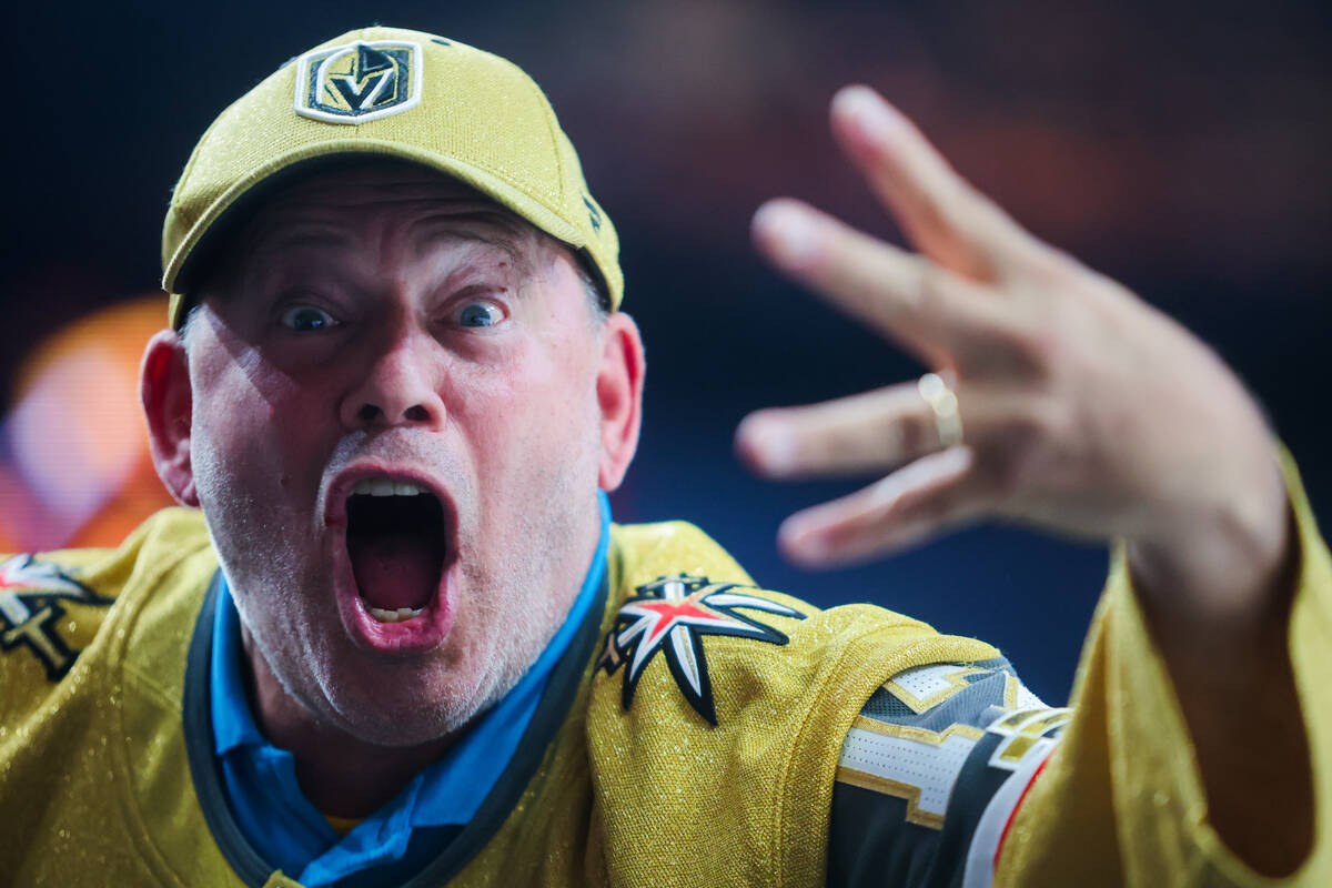 A Golden Knights fan celebrates the team’s fourth goal during the Golden Knights’ ...