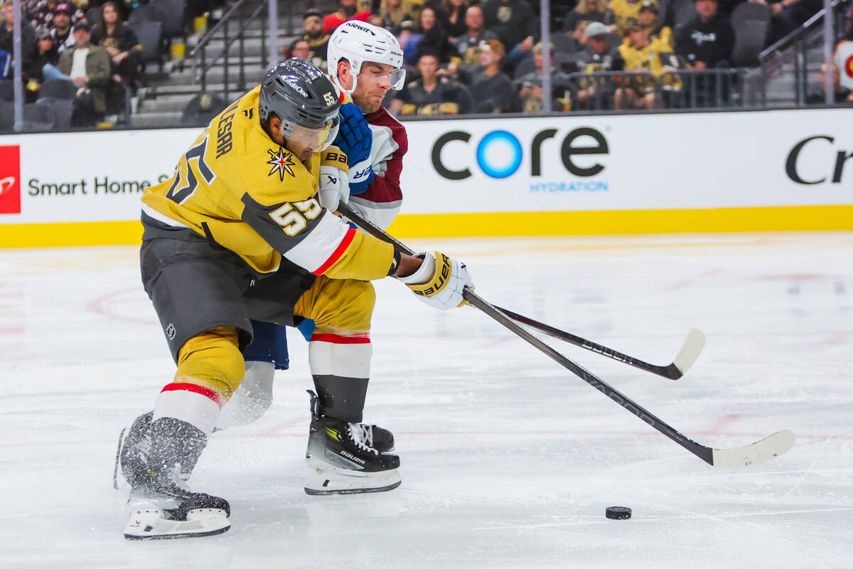 Golden Knights right wing Keegan Kolesar (55) works his way into possession of the puck during ...