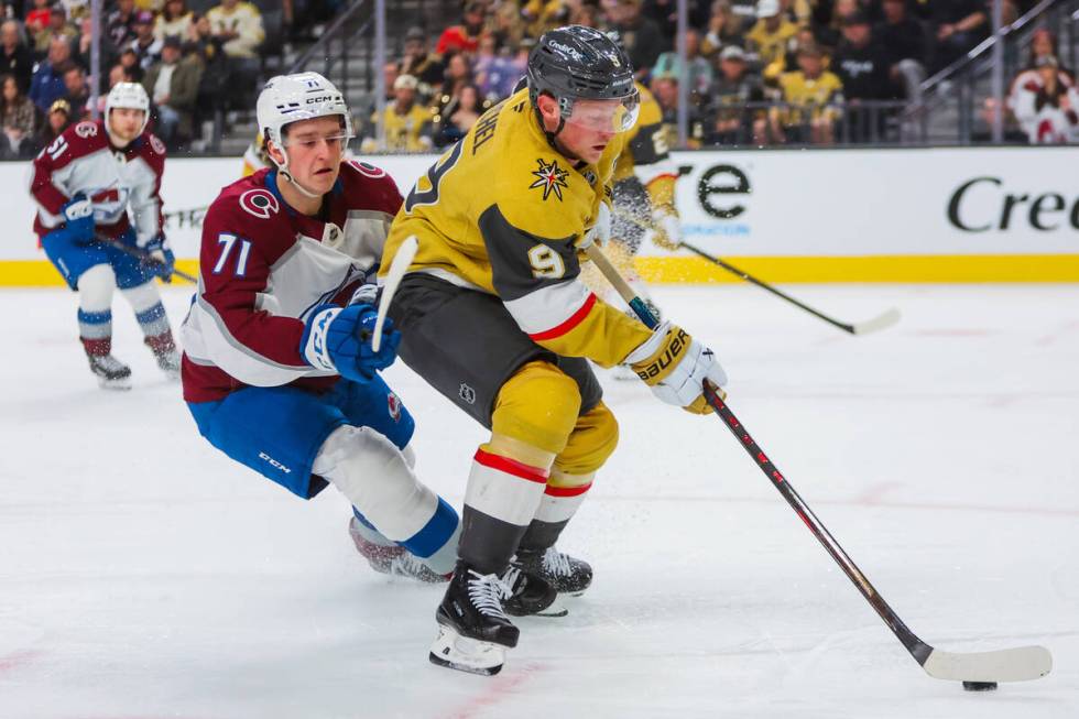 Golden Knights center Jack Eichel (9) works the puck while Colorado Avalanche center Calum Ritc ...