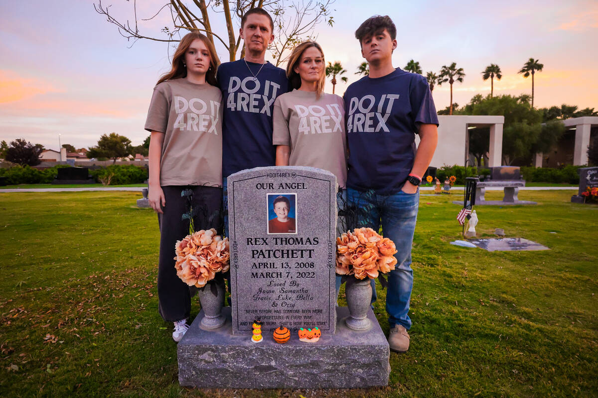 Bella, from left, Jason, Samantha and Travis Patchett all stand at the grave of Rex Patchett, a ...