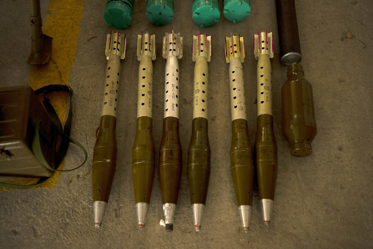 The Israeli Defense Forces display weapons seized in on a base in southern Israel, Wednesday, O ...