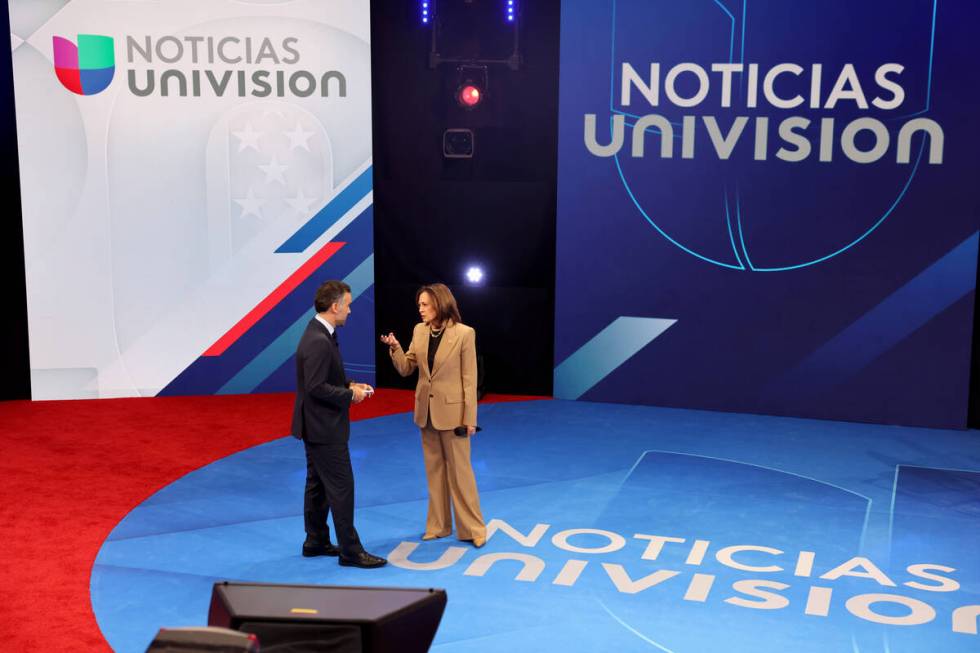 Vice President Kamala Harris talks with Noticias Univision anchor Enrique Acevedo during a comm ...