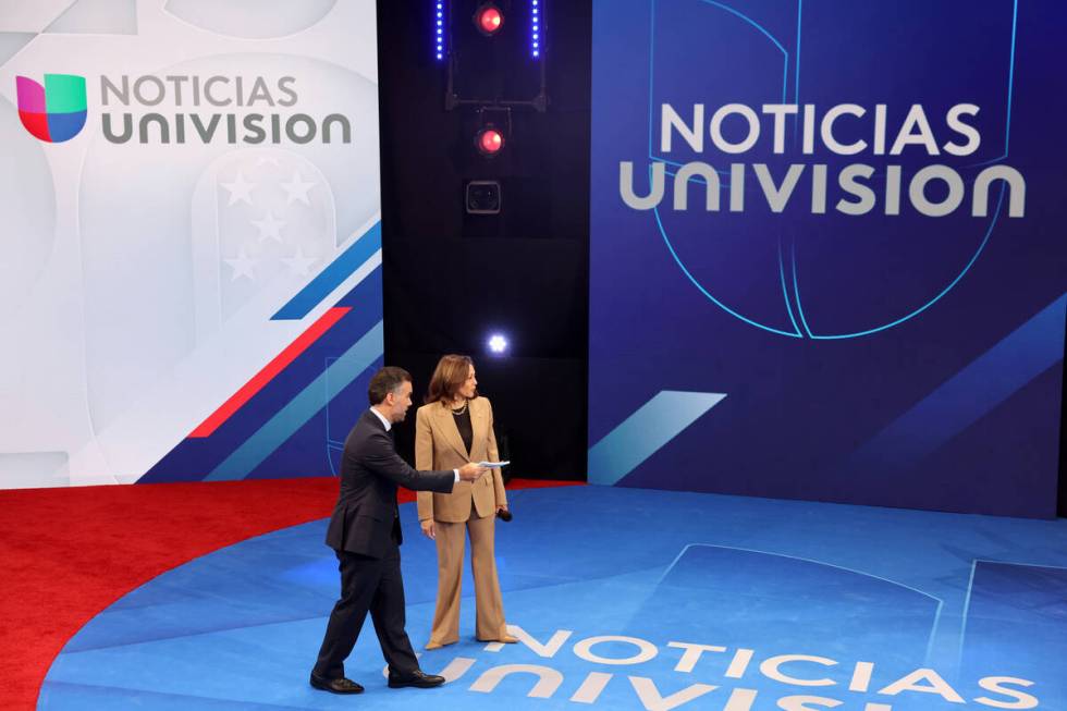 Vice President Kamala Harris talks with Noticias Univision anchor Enrique Acevedo during a comm ...