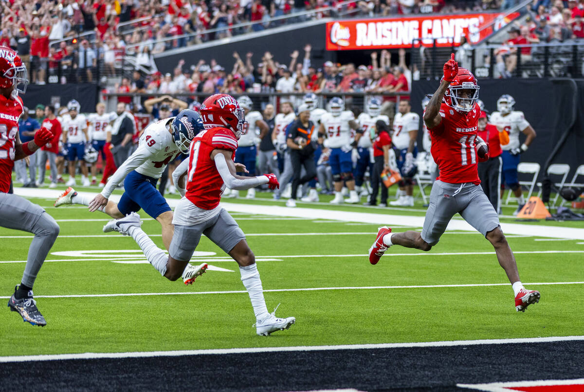 UNLV wide receiver Ricky White III (11) scores a touchdown off a blocked punt on the Fresno Sta ...