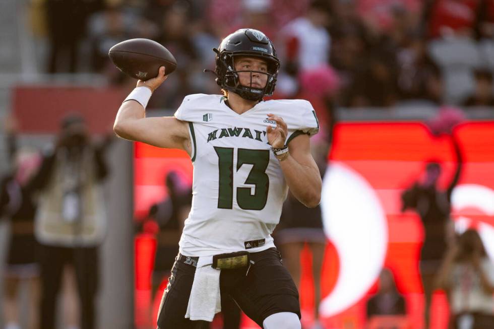 Hawaii quarterback Brayden Schager (13) throws a pass during an NCAA football game against San ...