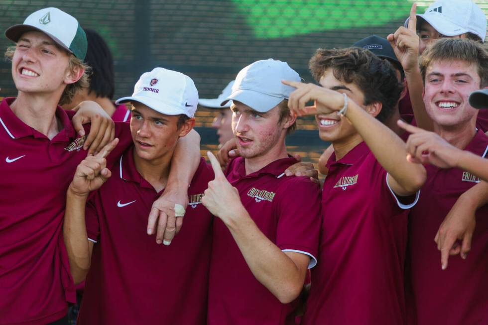 Faith Lutheran teammates celebrate during a 5A high school boys tennis state championships matc ...