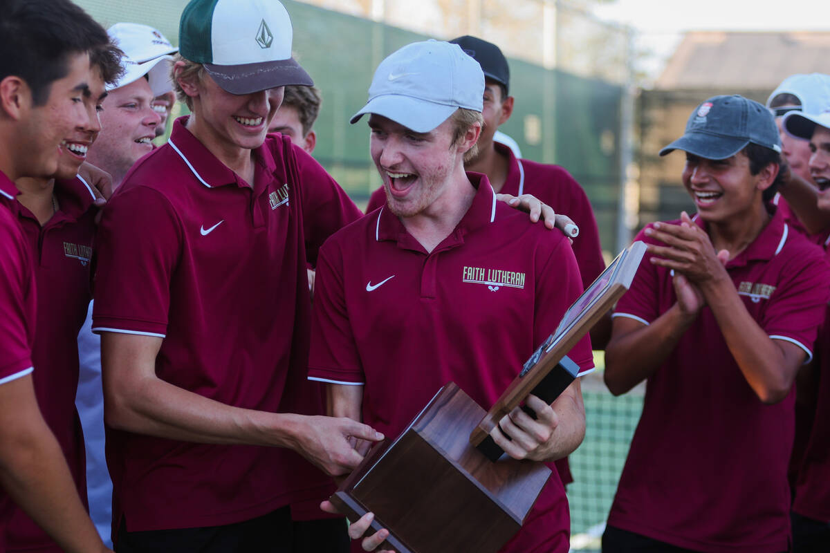 Faith Lutheran teammates celebrate during a 5A high school boys tennis state championships matc ...