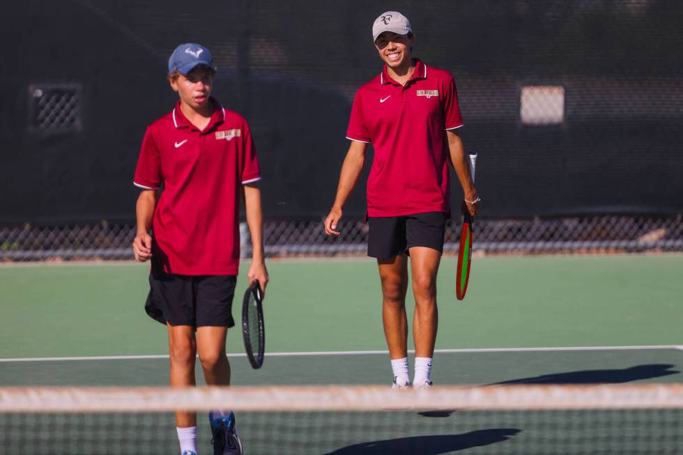 Faith Lutheran’s Beckham Butler, right, smiles during a 5A high school boys tennis state cham ...