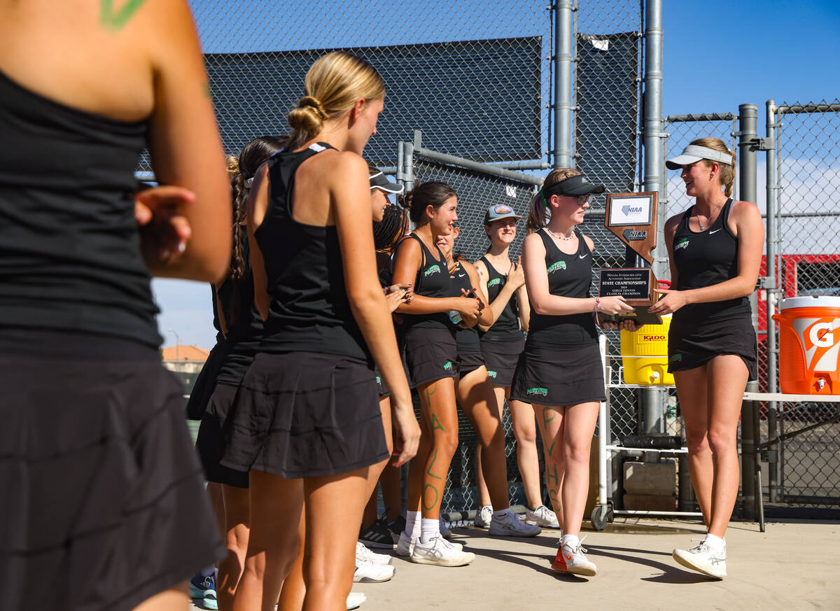 The Palo Verde High School girls tennis team celebrates winning the Class 5A tennis state champ ...