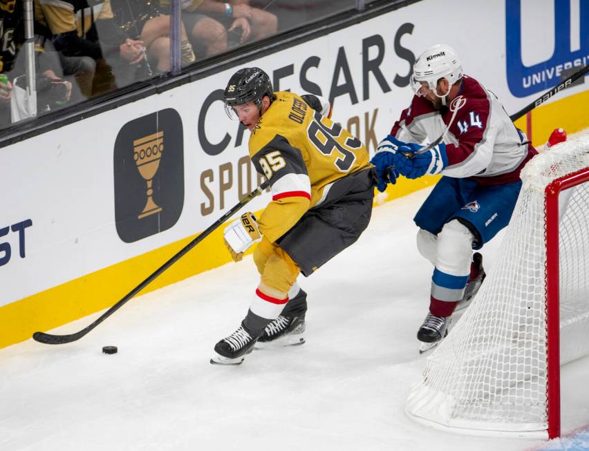 Vegas Golden Knights right wing Victor Olofsson (95) keeps the puck from Colorado Avalanche def ...