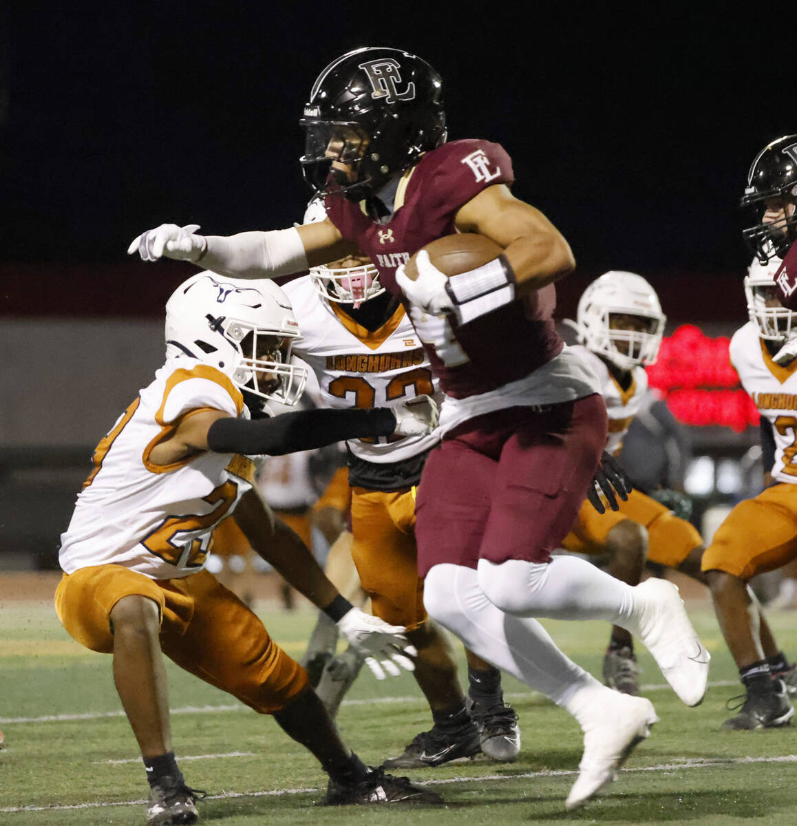 Faith Lutheran's wide receiver Rouselle Shepard (4) runs with the ball against Legacy High duri ...