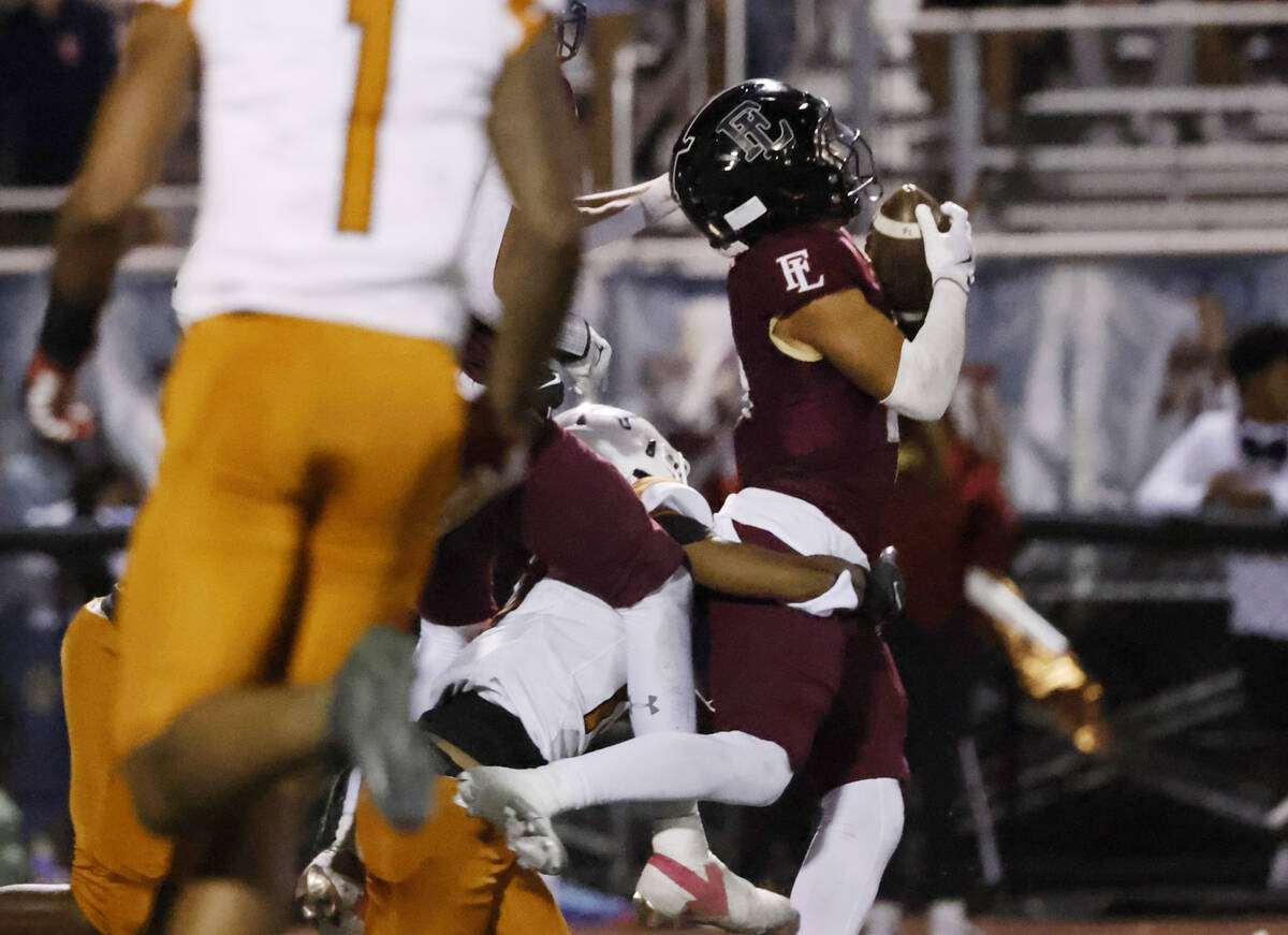 Faith Lutheran's wide receiver Rouselle Shepard (4) catches the ball during the second half of ...