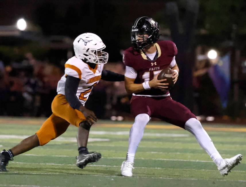 Faith Lutheran's quarterback Alexander Rogers (15) is chased down by Legacy High's defensive en ...