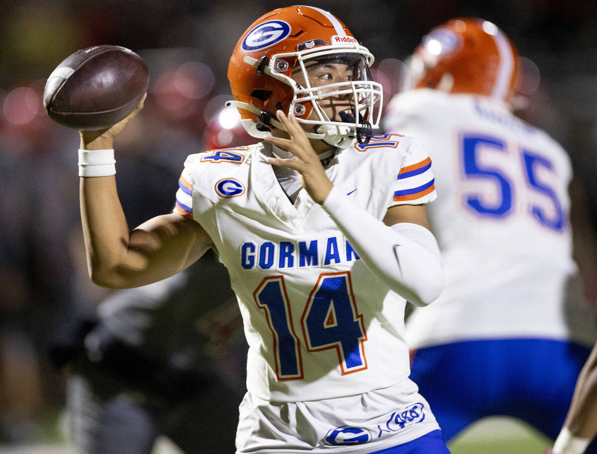 Bishop Gorman quarterback Maika Eugenio (14) looks to throw the ball during the high school foo ...