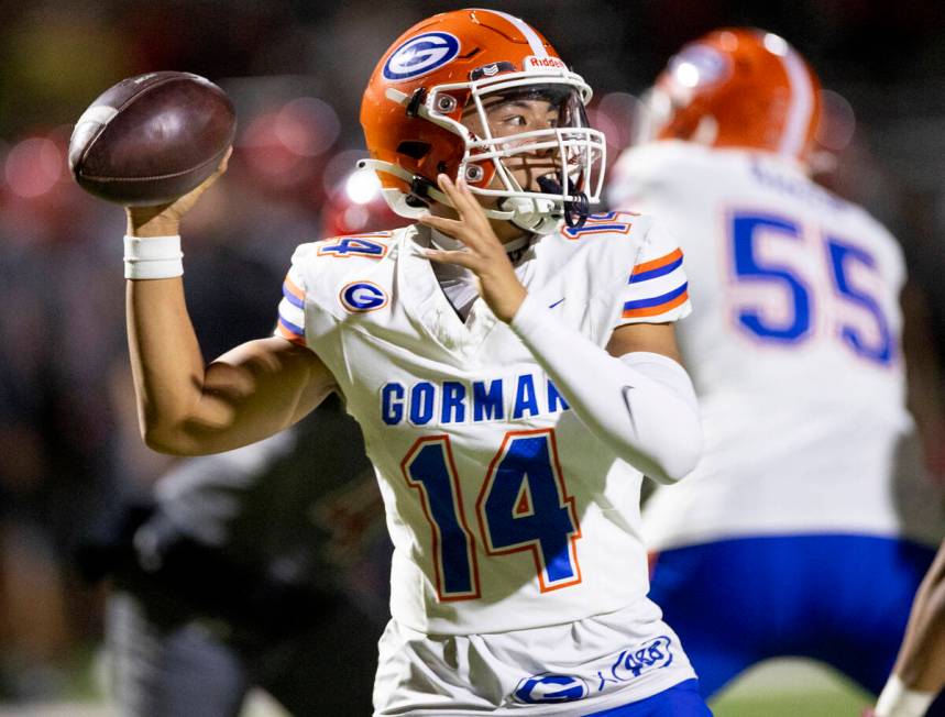 Bishop Gorman quarterback Maika Eugenio (14) looks to throw the ball during the high school foo ...