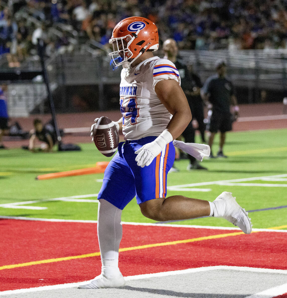 Bishop Gorman defensive lineman Sione Motuapuaka (44) scores a touchdown during the high school ...