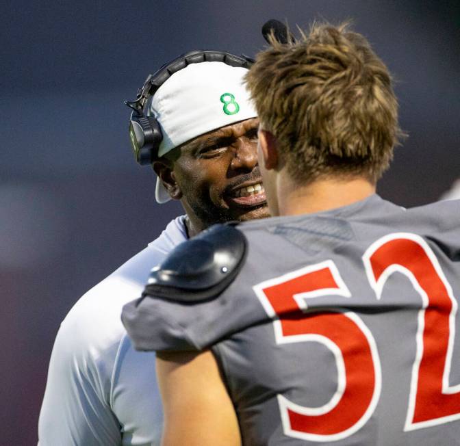 Arbor View Head Coach Marlon Barnett yells at Arbor View linebacker Rocky Campbell (52) after r ...