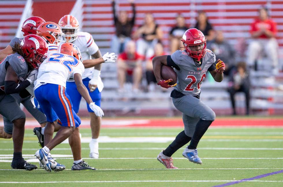 Arbor View running back Kaine Berry (26) runs with the ball during the high school football gam ...