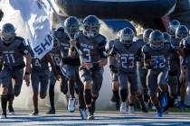 Shadow Ridge quarterback Ula Cox (3) leads the team out onto the field before the high school f ...