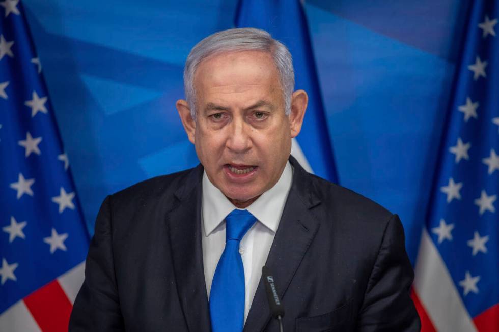 Israeli Prime Minister Benjamin Netanyahu delivers a statement following his meeting with US Se ...