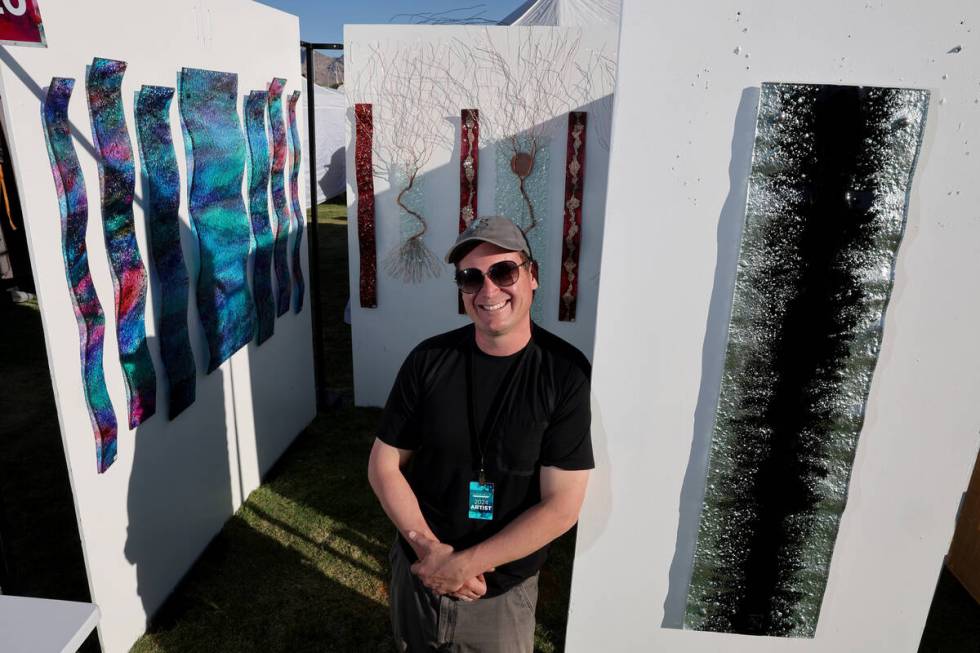 Robert Barnett of Gravity Glass Art in Sedona, Ariz. shows his artwork during Summerlin Festiva ...