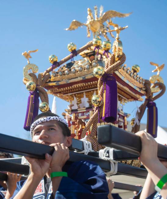 People carry a Mikoshi during the Aki Matsuri Japanese Festival at Water Street Plaza, Saturday ...